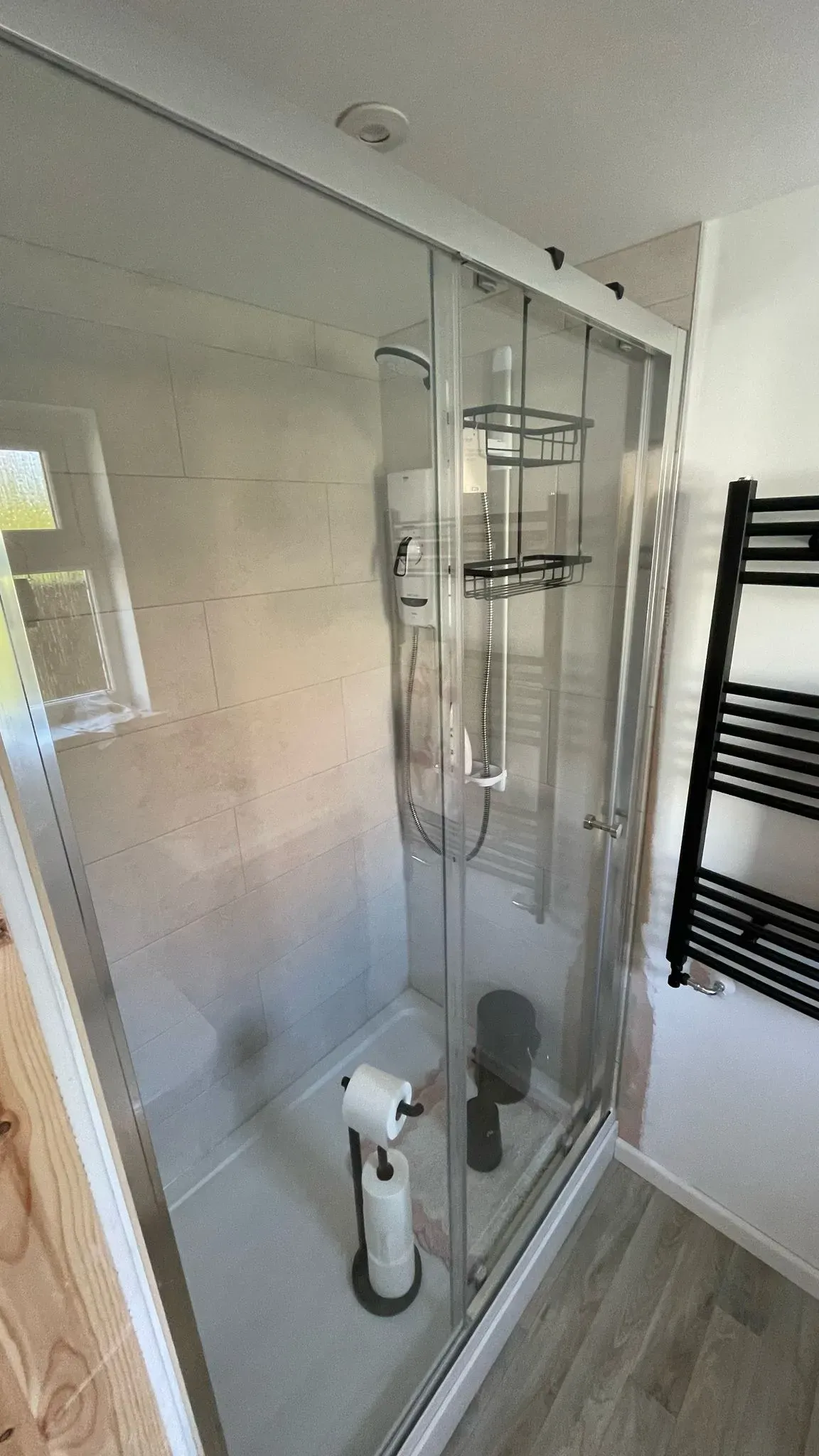 Modern glass shower cubicle installation in a renovated bathroom in Cheltenham
