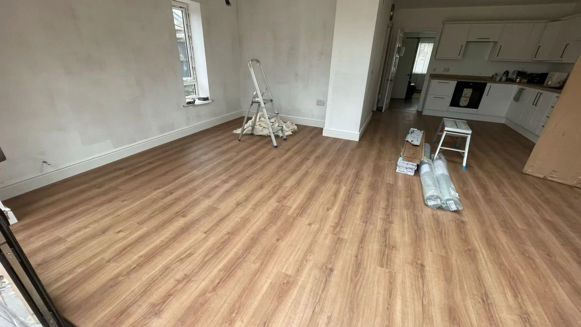 Newly installed wood-effect flooring during a home renovation project in Cheltenham by DP Carpentry and Building LTD.