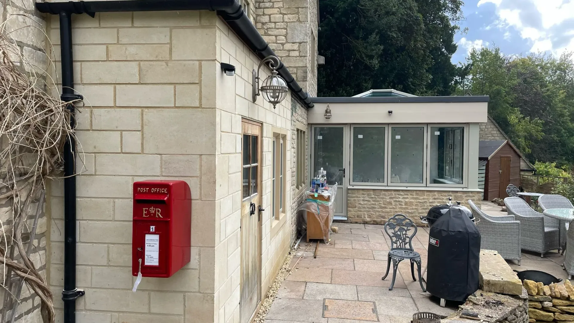 Stone house extension and patio area in Gloucestershire.