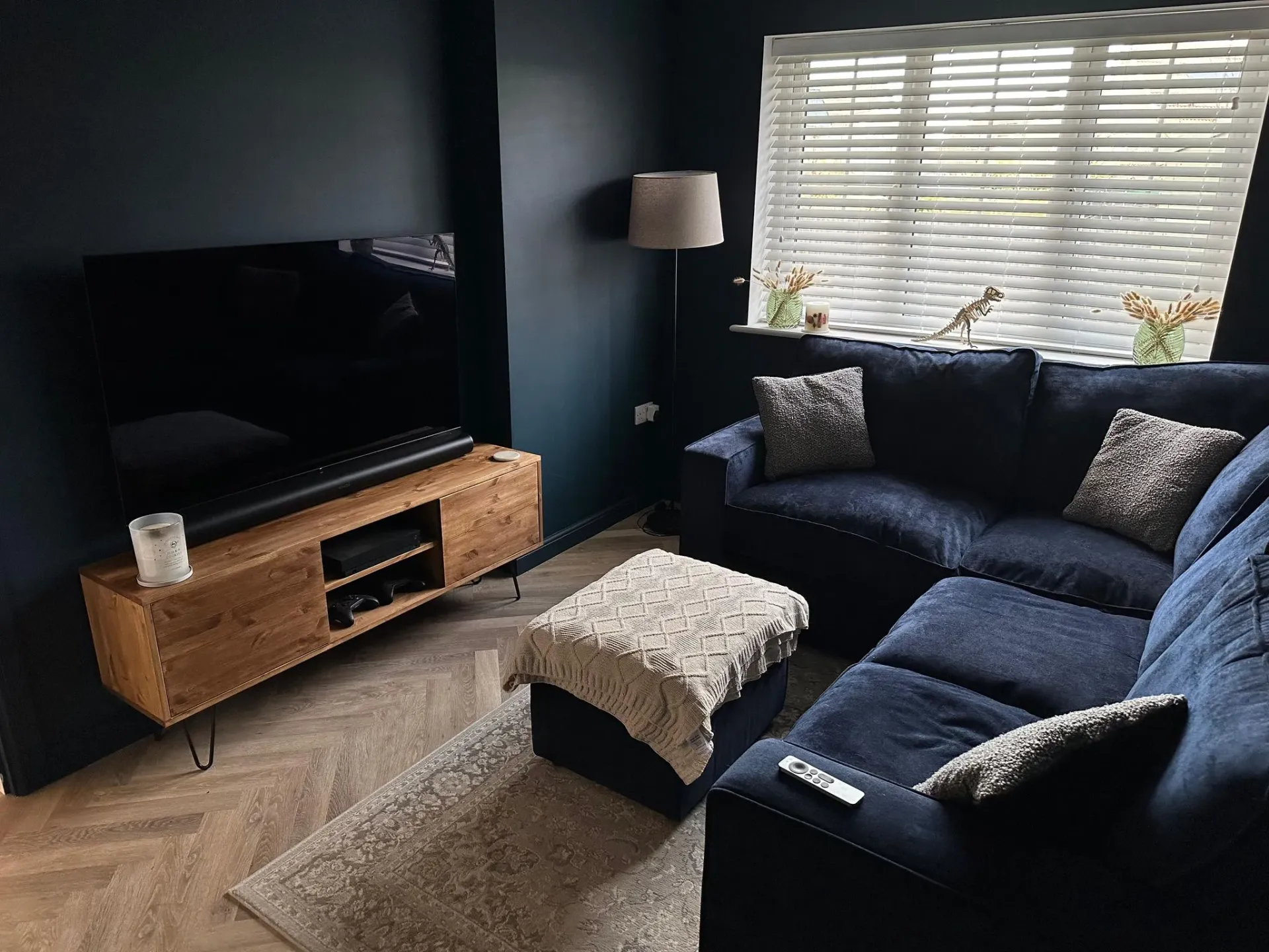 Renovated living room in Hatherley with bespoke wooden TV unit by DP Carpentry & Building LTD.