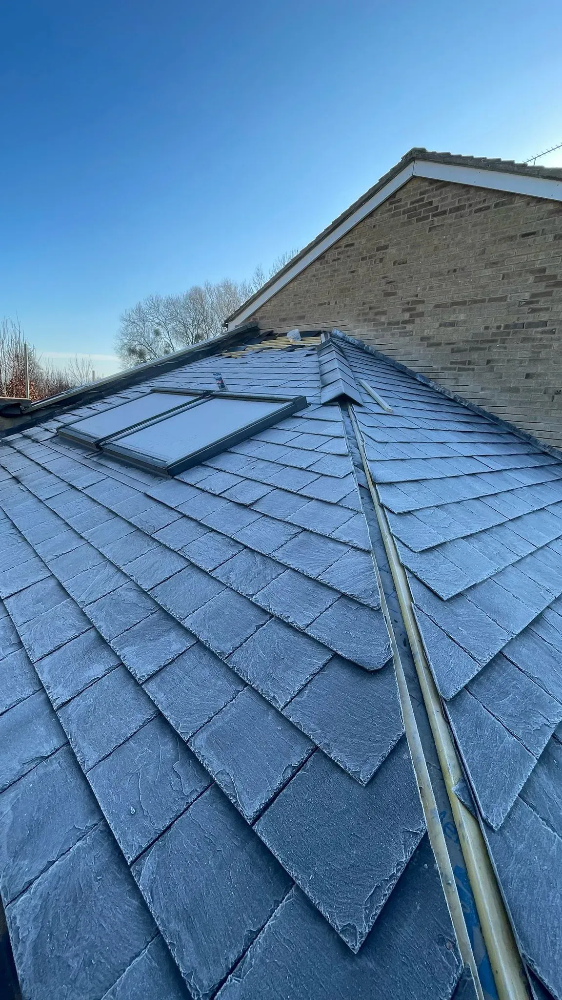 Expertly installed Velux windows on a slate roof in Hatherley, Gloucestershire by DP Carpentry & Building LTD.